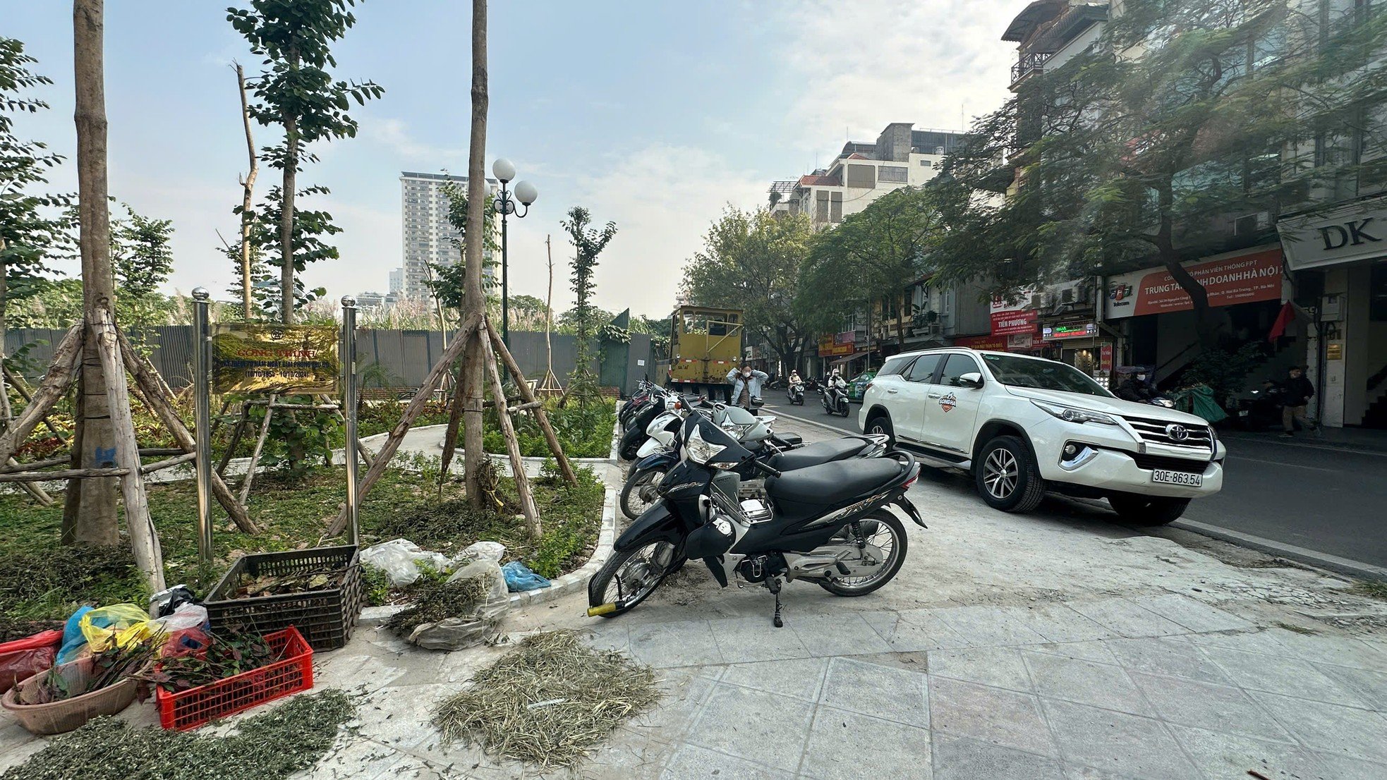 Sidewalks not yet dry but already 'shredded' by cars and motorbikes photo 10