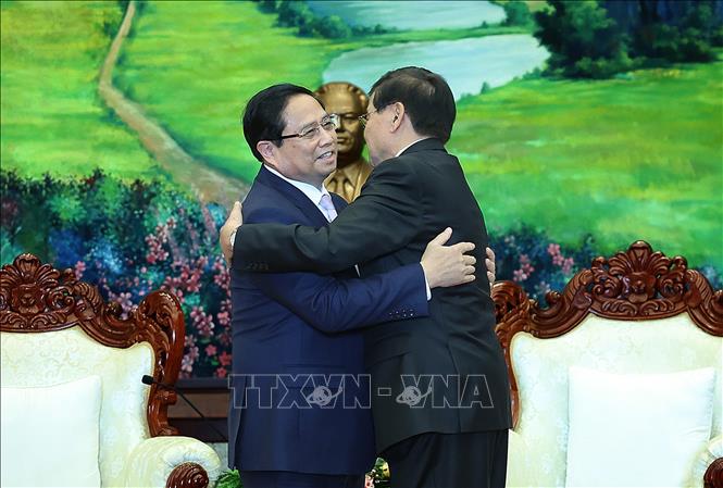 Le Premier ministre Pham Minh Chinh rencontre le secrétaire général et le président du Laos