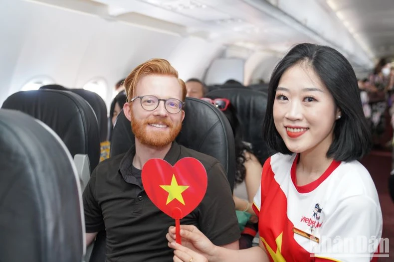 Brilliant red flags with yellow stars celebrate National Day September 2nd on Vietjet flights photo 5