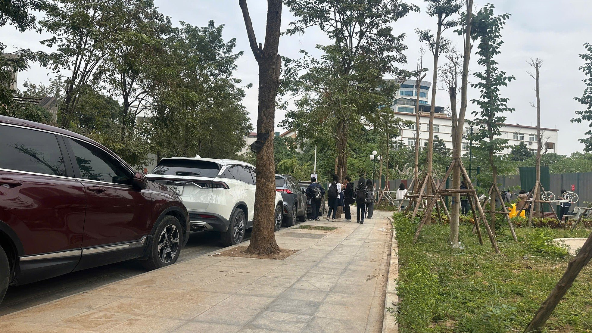 Sidewalks not yet dry but already 'shredded' by cars and motorbikes photo 11