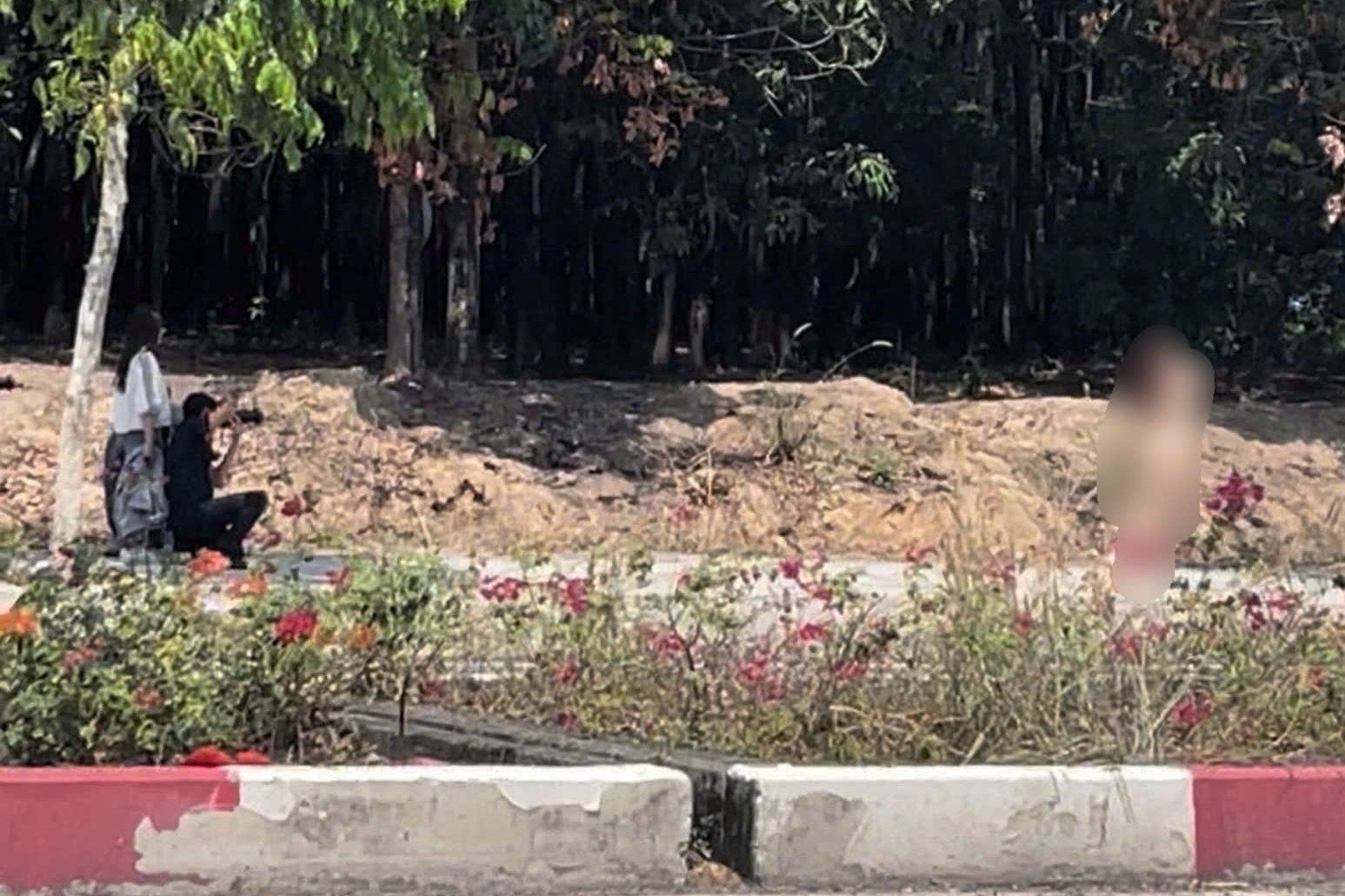 Group of people organize nude photo shoot on the street in Binh Duong