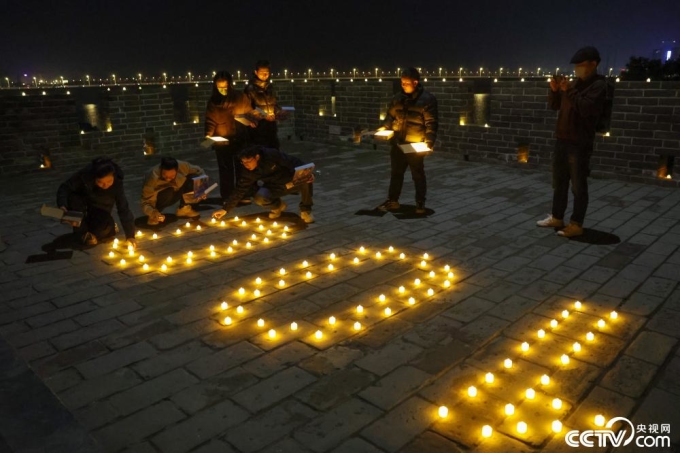 People light up the ancient citadel. Photo: CCTV