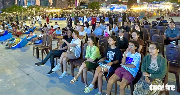 Watching movies outdoors by the Saigon River