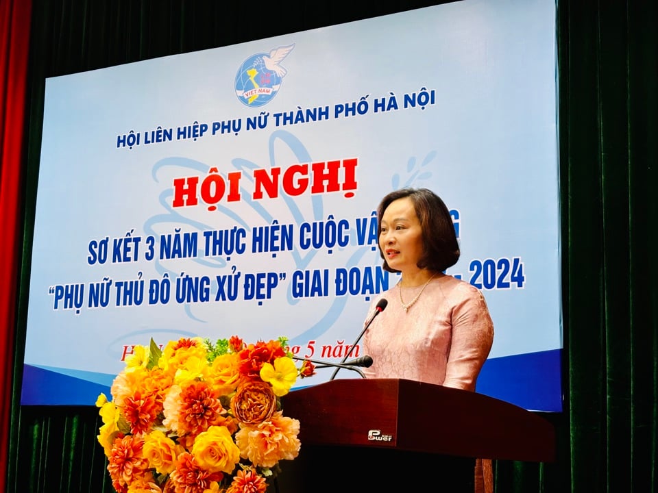 Pham Thi Thanh Huong รองประธานสหภาพสตรีประจำเมืองกล่าวสุนทรพจน์เปิดงานประชุม