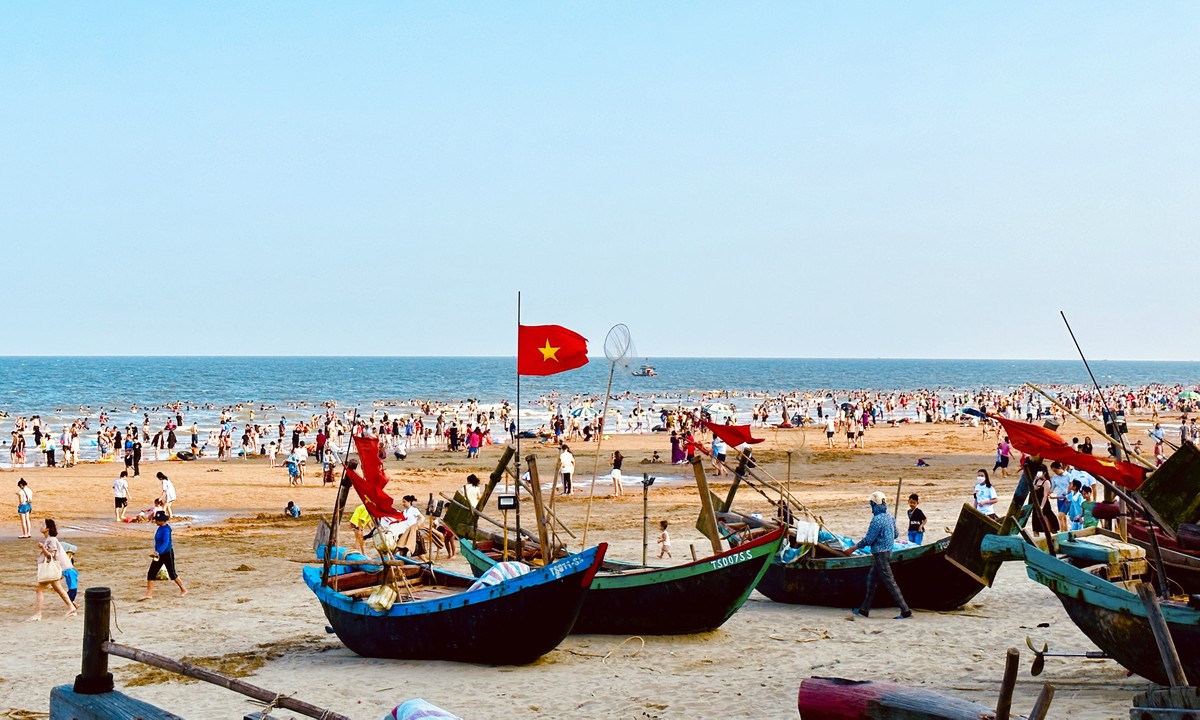 Bustling posing next to the fishing village in the middle of Sam Son beach city photo 2