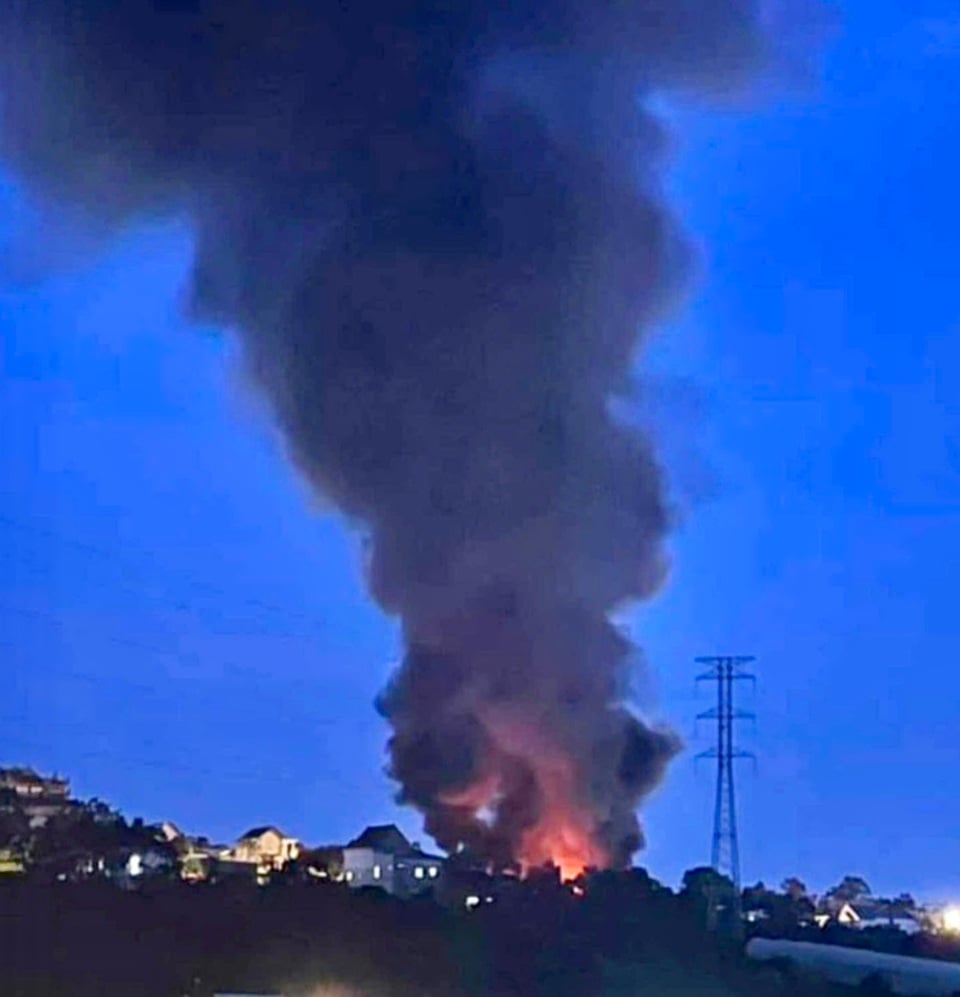 The fire created a column of smoke hundreds of meters high.