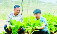 Mr. Bui Ngoc Chau (right), 1 of 100 faces of 