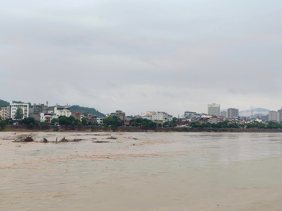 Red River water flows through Lao Cai city this morning.