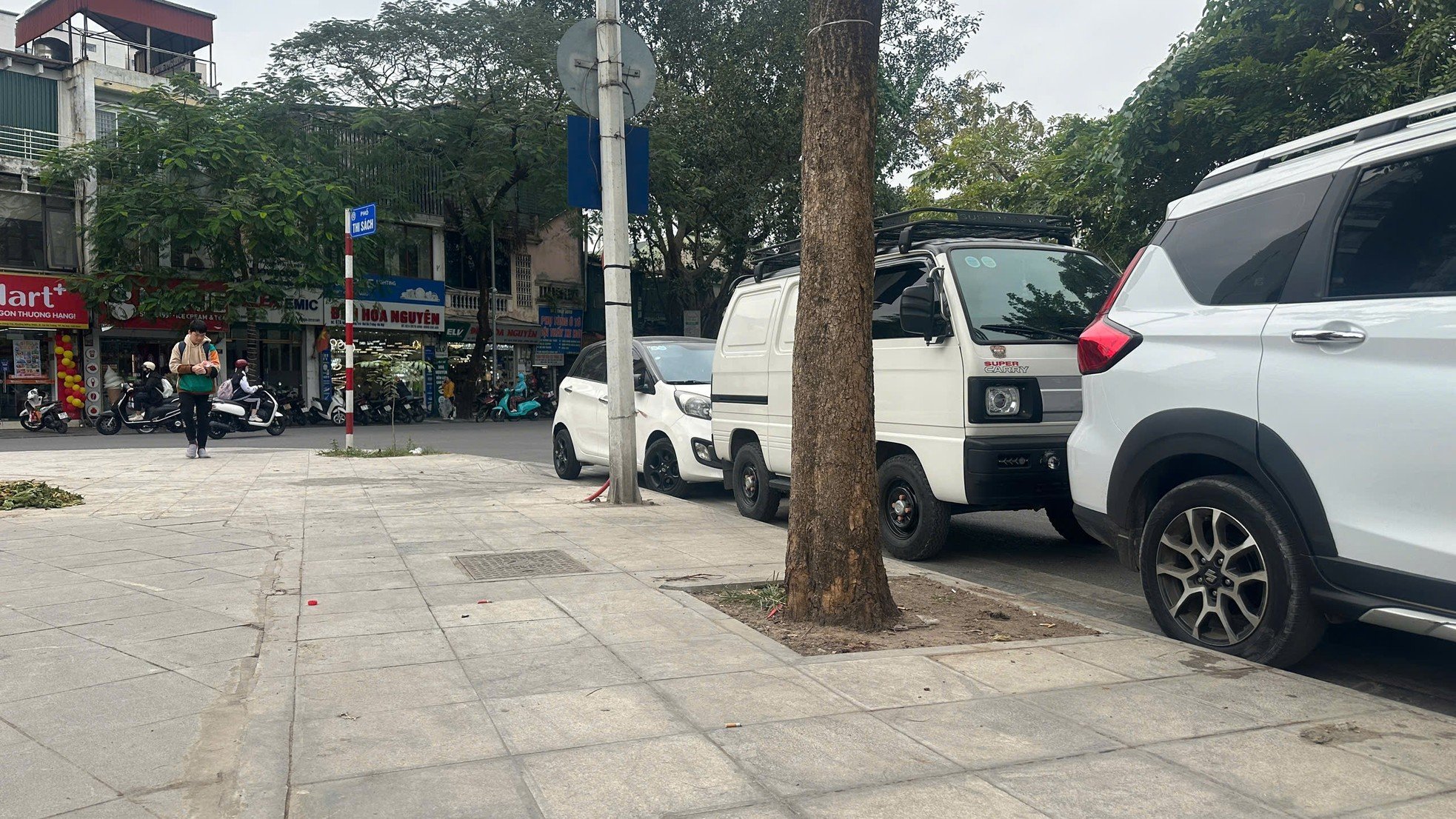 Sidewalks not yet dry but already 'shredded' by cars and motorbikes photo 12