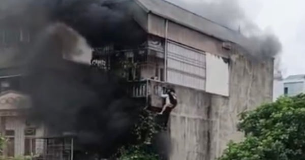 „Held“ klettert über Mauer und trägt zwei Mädchen, um am frühen Morgen einem Brand in einem Motel in Hanoi zu entkommen