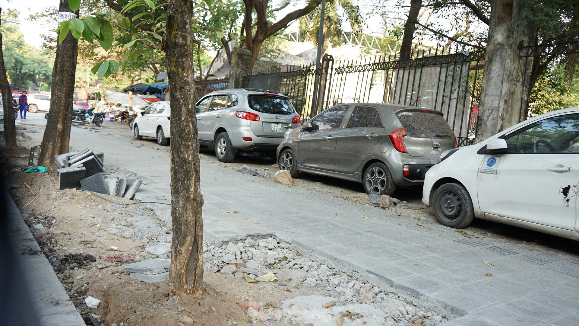 Sidewalks not yet dry mortar has been 'chopped up' by cars and motorbikes photo 4