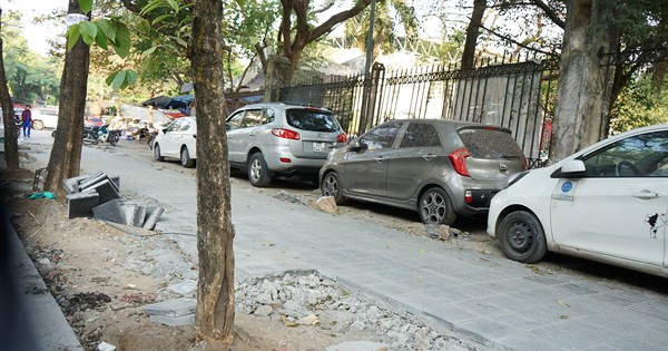 Sidewalks are not yet dry but have been 'chopped up' by cars and motorbikes