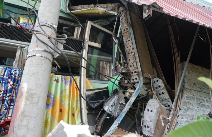 Electric pole and wood workshop wall collapsed. Photo: Lam Son