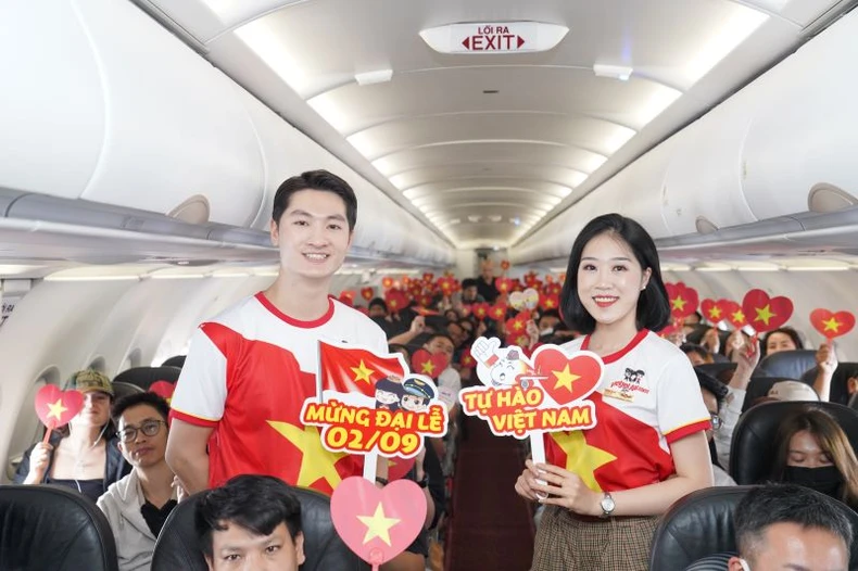 Brilliant red flags with yellow stars celebrate National Day September 2 on Vietjet flights photo 1