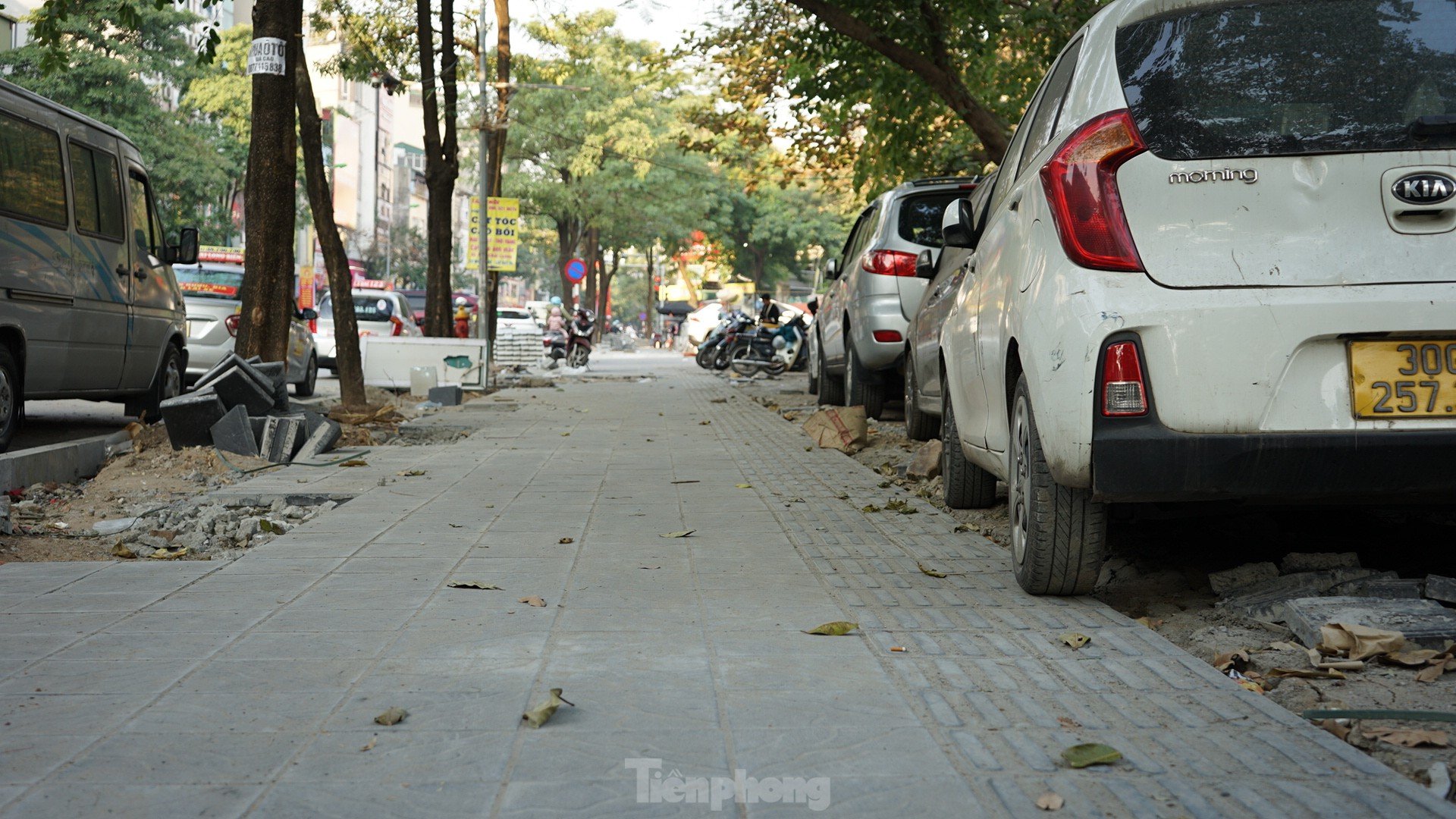 Sidewalks not yet dry mortar has been 'chopped up' by cars and motorbikes photo 5