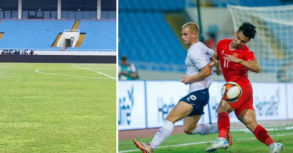 El césped del Estadio My Dinh está siendo cuidado después del partido contra Vietnam.