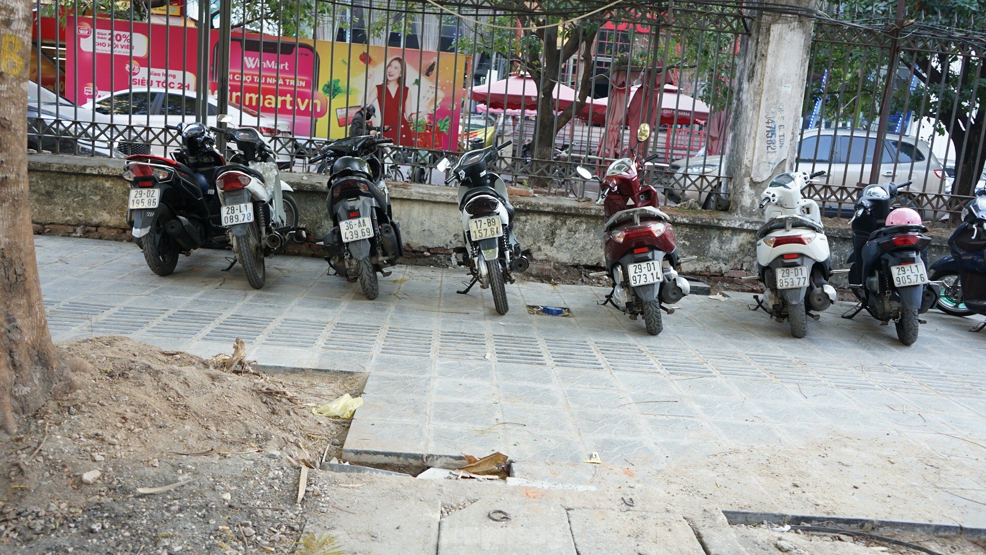 Sidewalks not yet dry mortar has been 'chopped up' by cars and motorbikes photo 2