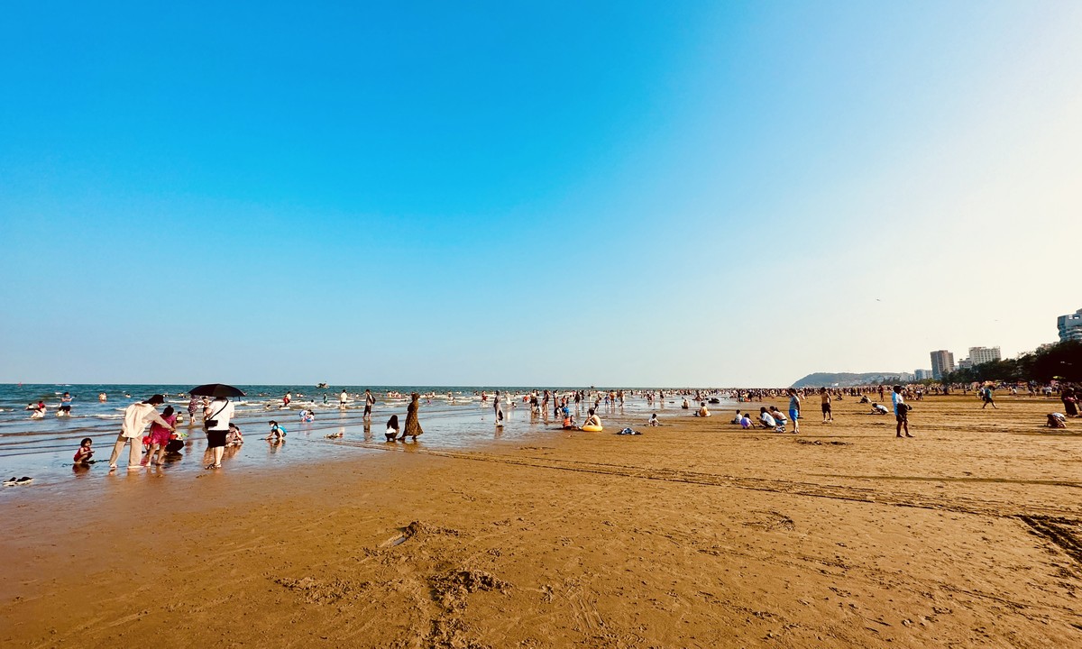 Bustling posing next to the fishing village in the middle of Sam Son beach city photo 1