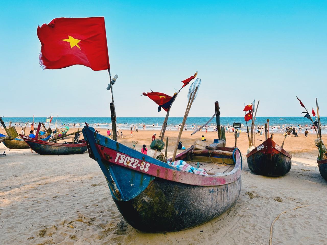 Bustling posing next to the fishing village in the middle of Sam Son beach city photo 3