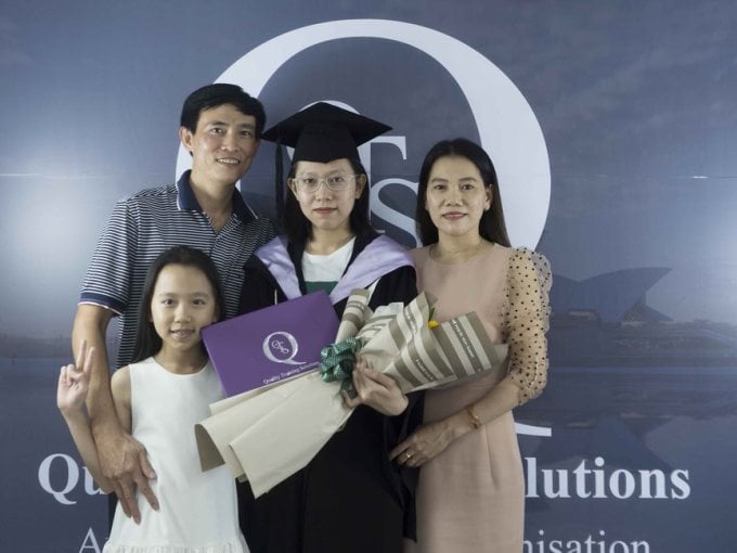 Thao Vi on her graduation day from the QTS BSB50102 Diploma of Business program. Photo: Provided by the character