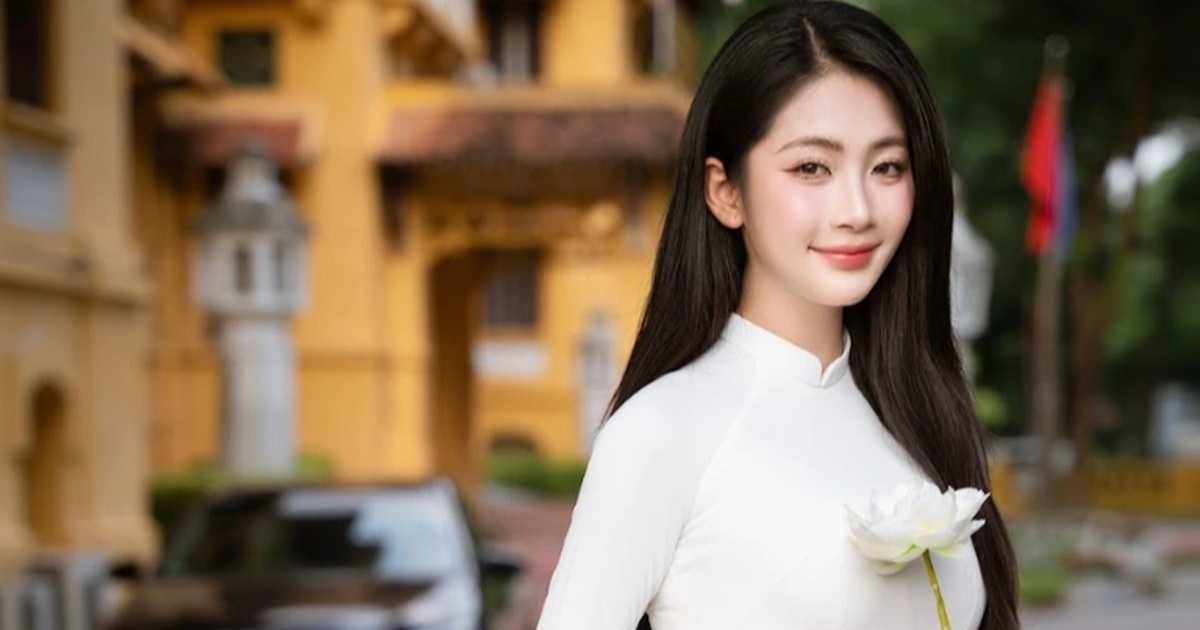 Tay ethnic beauty shows off her graceful figure in a white ao dai