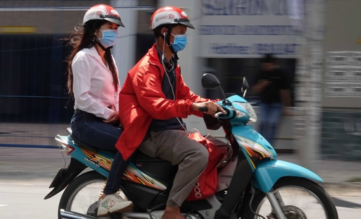 What is the penalty for wearing headphones while riding a motorbike? Image 1