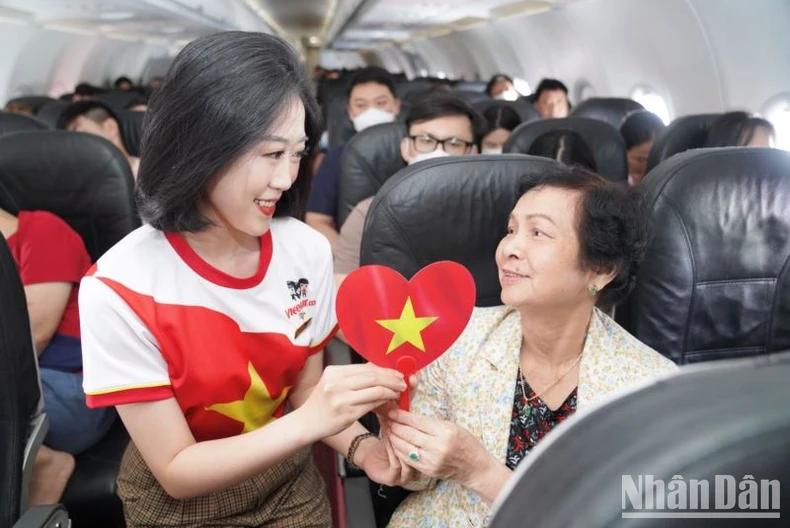 Brilliant red flags with yellow stars celebrate National Day September 2nd on Vietjet flights photo 7