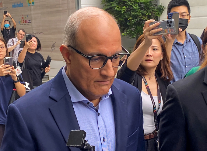 Mr. S. Iswaran (left) leaves court in Singapore on January 18. Photo: AFP