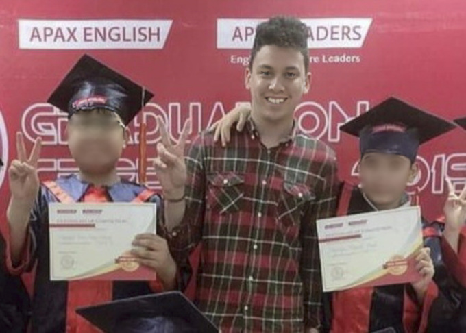 Callan Williams poses for a photo with his students at an Apax Leaders center when he was still working for the school. Photo courtesy of Williams.