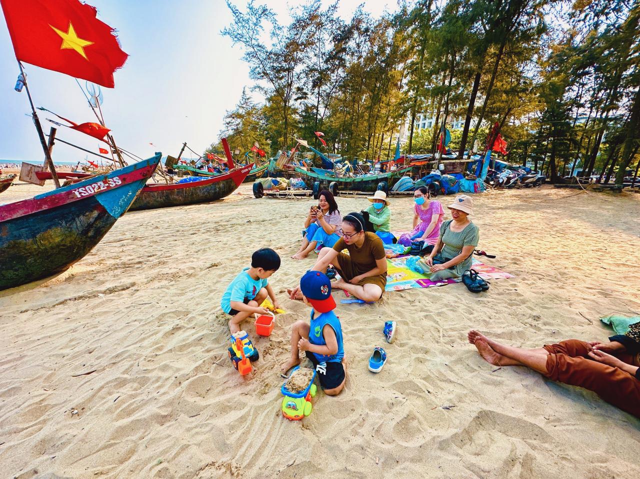 Bustling posing next to the fishing village in the middle of Sam Son beach city photo 5