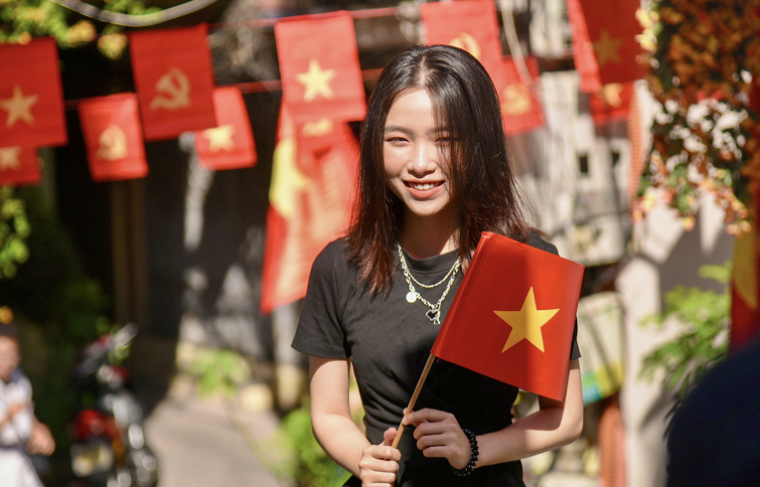 Small street corners in Hanoi are turning towards the national flag.