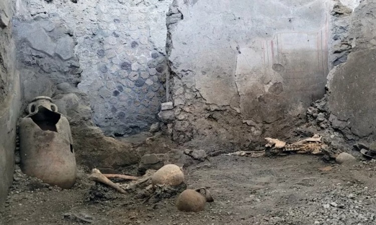 Remains of victims buried under collapsed wall after volcanic disaster