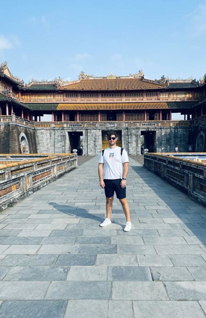 Australian male tourist takes a photo in front of the Imperial Citadel. Photo: Troy Nankervis