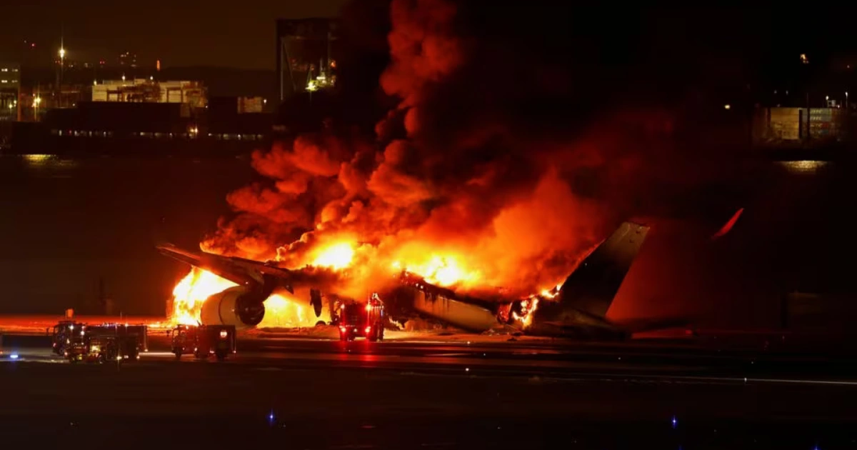 Plane carrying nearly 400 people burns on runway in Japan