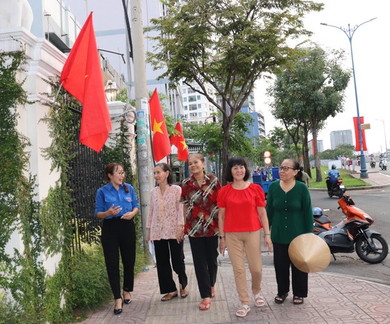 People and members of Ward 2, District 4 walk along the 