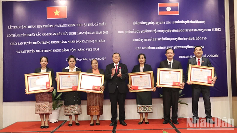 Vietnam and Laos strengthen cooperation between the two agencies of Propaganda and Education photo 4