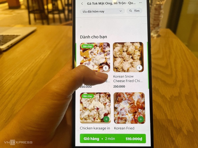 Users order food on Grab, one of two popular food ordering apps in Vietnam. Photo: Quynh Trang