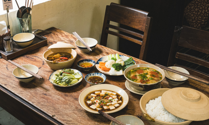 A tray of food with just enough dishes for a meal at a restaurant.