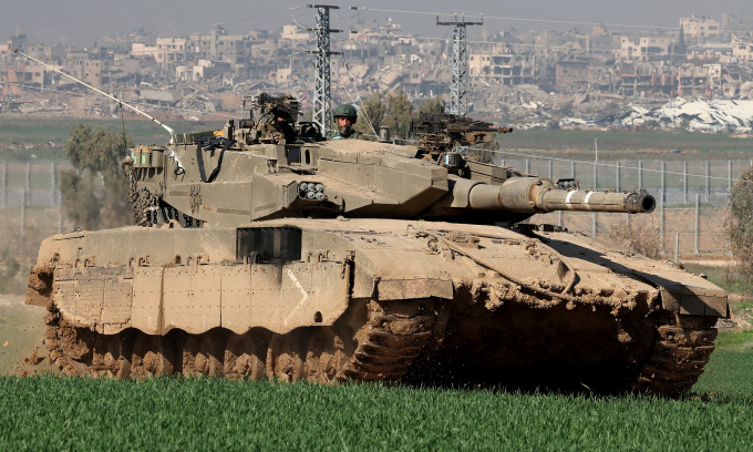 Israeli tanks deployed near the Gaza Strip border on January 19. Photo: AFP