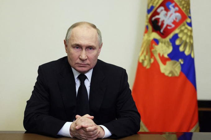 Le président russe Poutine s'exprime à la télévision le 23 mars au sujet de l'attentat terroriste contre un théâtre près de Moscou. Photo : Reuters