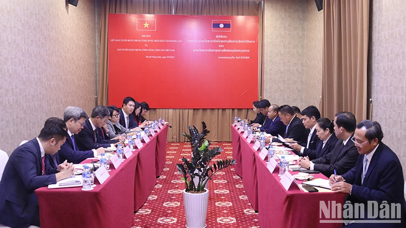 Vietnam, Laos strengthen cooperation between the two agencies of Propaganda and Education photo 2