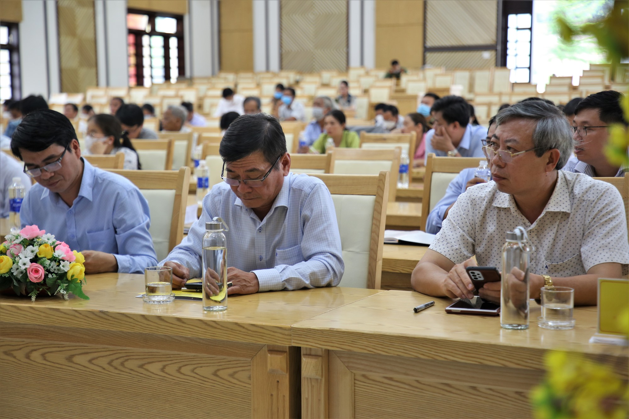 Representatives of provincial departments and agencies attended the meeting with voters. Photo: D.N