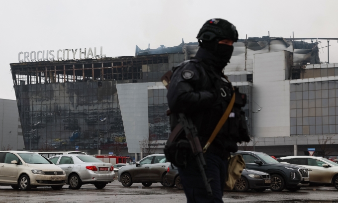 Russian law enforcement officers stand outside the scene of a shooting at the Crocus City Hall theater in Krasnogorsk, outside Moscow, on March 23. Photo: AFP