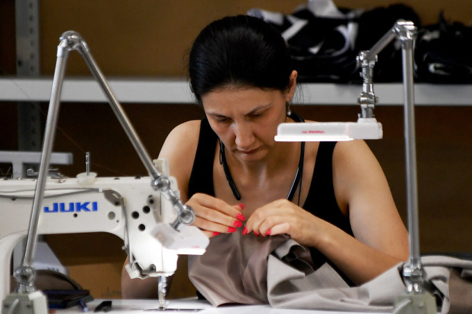 Workers at a factory producing for the YOU brand in Saint Petersburg on August 10. Photo: AFP