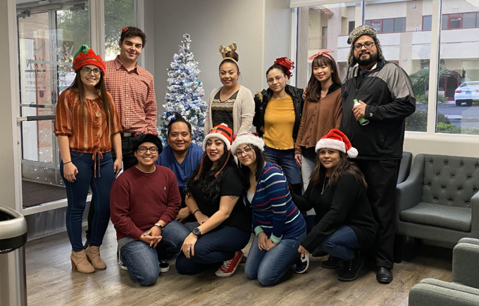 Duong (back row, second from right) with colleagues at Van Law Firm, Las Vegas, USA, on Christmas 2019. Photo: Character provided