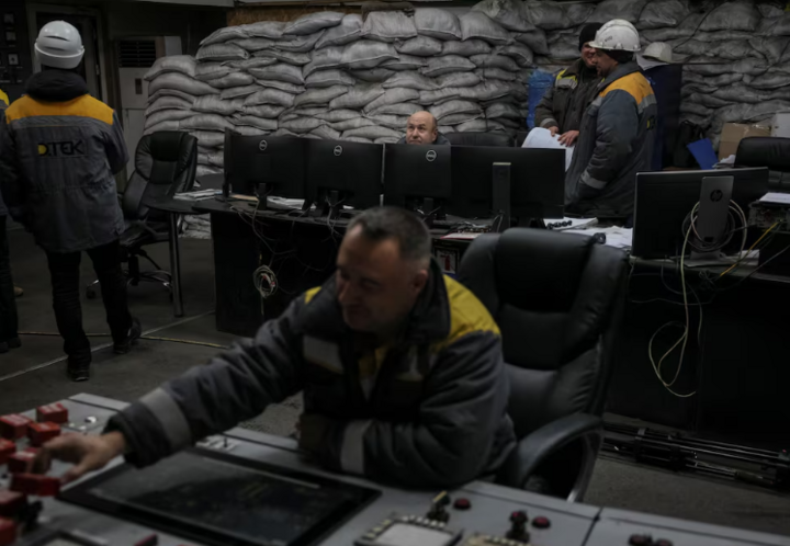 Workers in the control room are protected by sandbags. (Photo: Reuters)