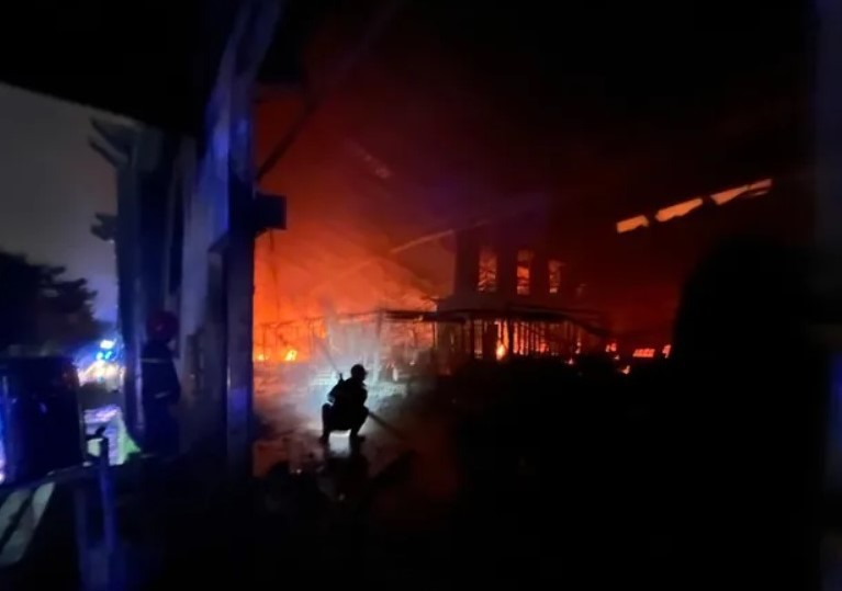 Thousands of square meters of factory is on fire.