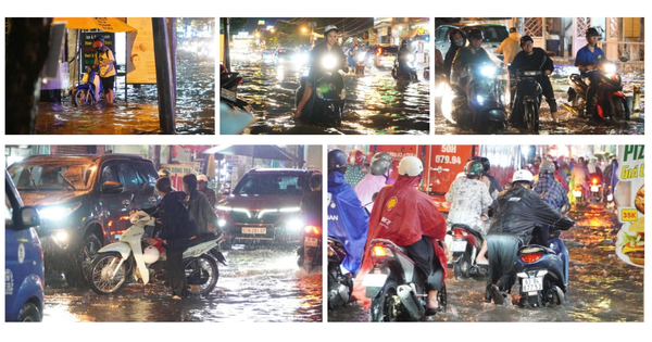 Una serie de vehículos se detuvieron, la gente tuvo que atravesar el agua para regresar a casa después de las fuertes lluvias.