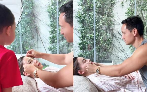 Ho Ngoc Ha gets a face mask from her husband. Photo: Screenshot