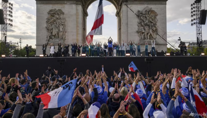 France bids farewell to Olympics with parade down Champs-Elysees